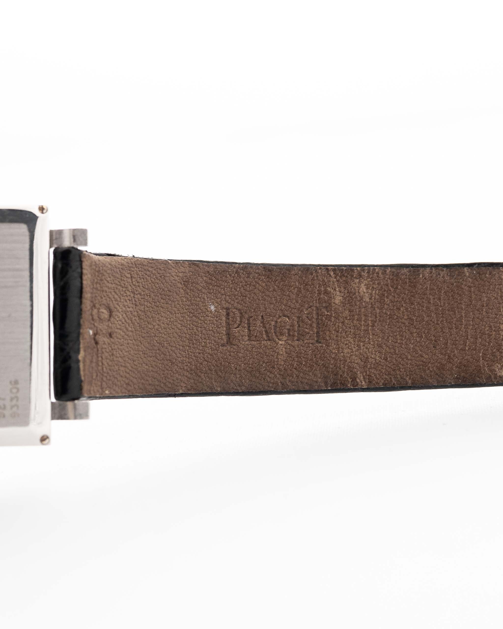 Closeup Photo of a Piaget Protocole 927 18k White Gold from the 1970s. 25mm in 18k White Gold with Manual wind movement, Silver sunburst dial and Original black leather strap.