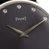 Closeup of a Vintage Piaget Altiplano 9025 Dial with Diamond 18k Grey from 1990s. 33mm in 18k white gold with Manual wind movement, Dark grey sunburst dial, Diamond hour markers and black Leather strap.