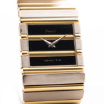 Gold Vintage Piaget Polo 7131 Onyx Zebra watch from the 1980s with a white background. 25mm wide, 18k white/yellow gold with Flawless Onyx and Zebra Dial, Gold bracelet.