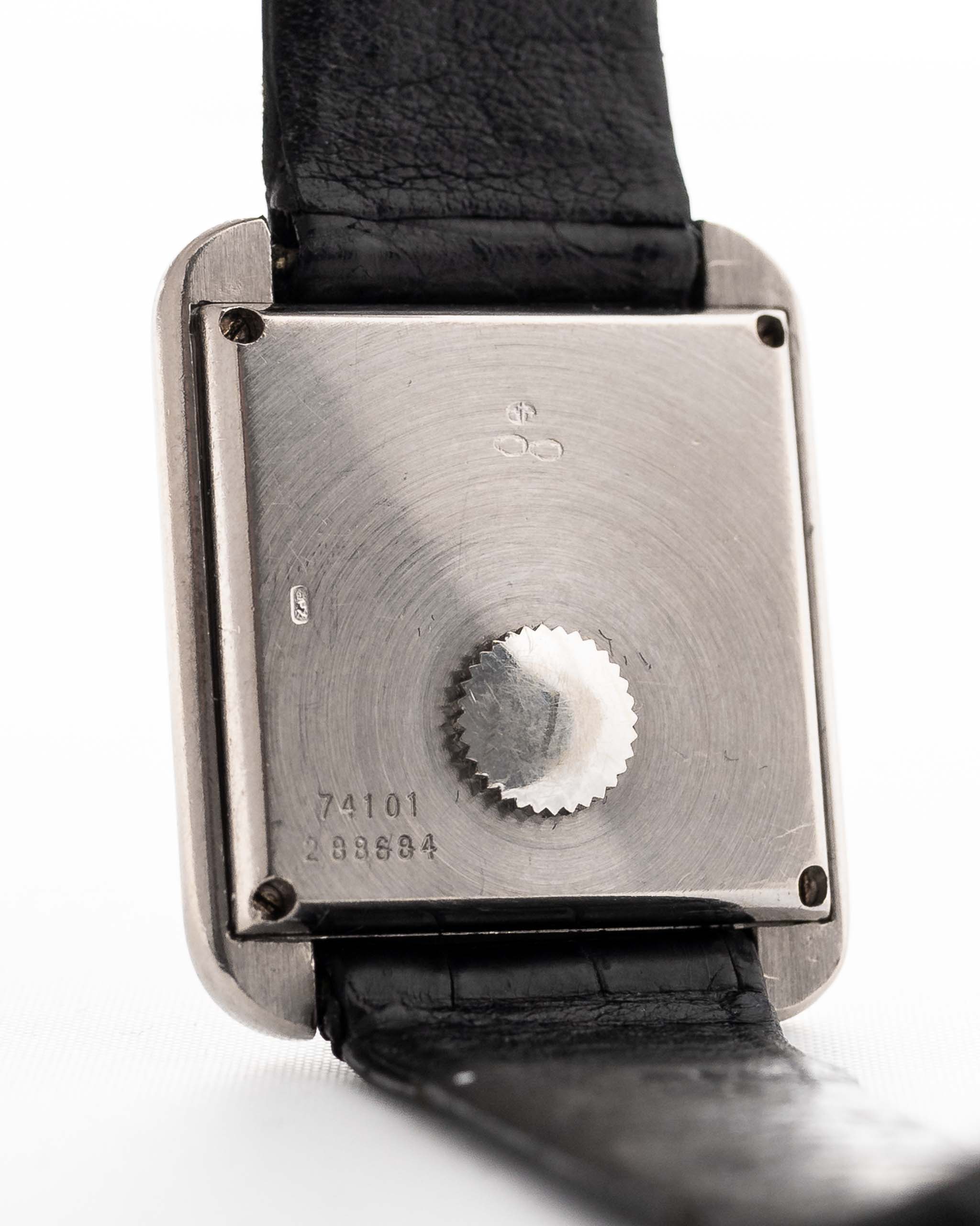 Closeup Photo of a Piaget Protocole 74101 Onyx 18k Diamond from the 1980s on a wrist. 26mm 18k White Gold Case with Onyx Dial with 4 Diamonds, Quartz Movement and Original Leather Strap.