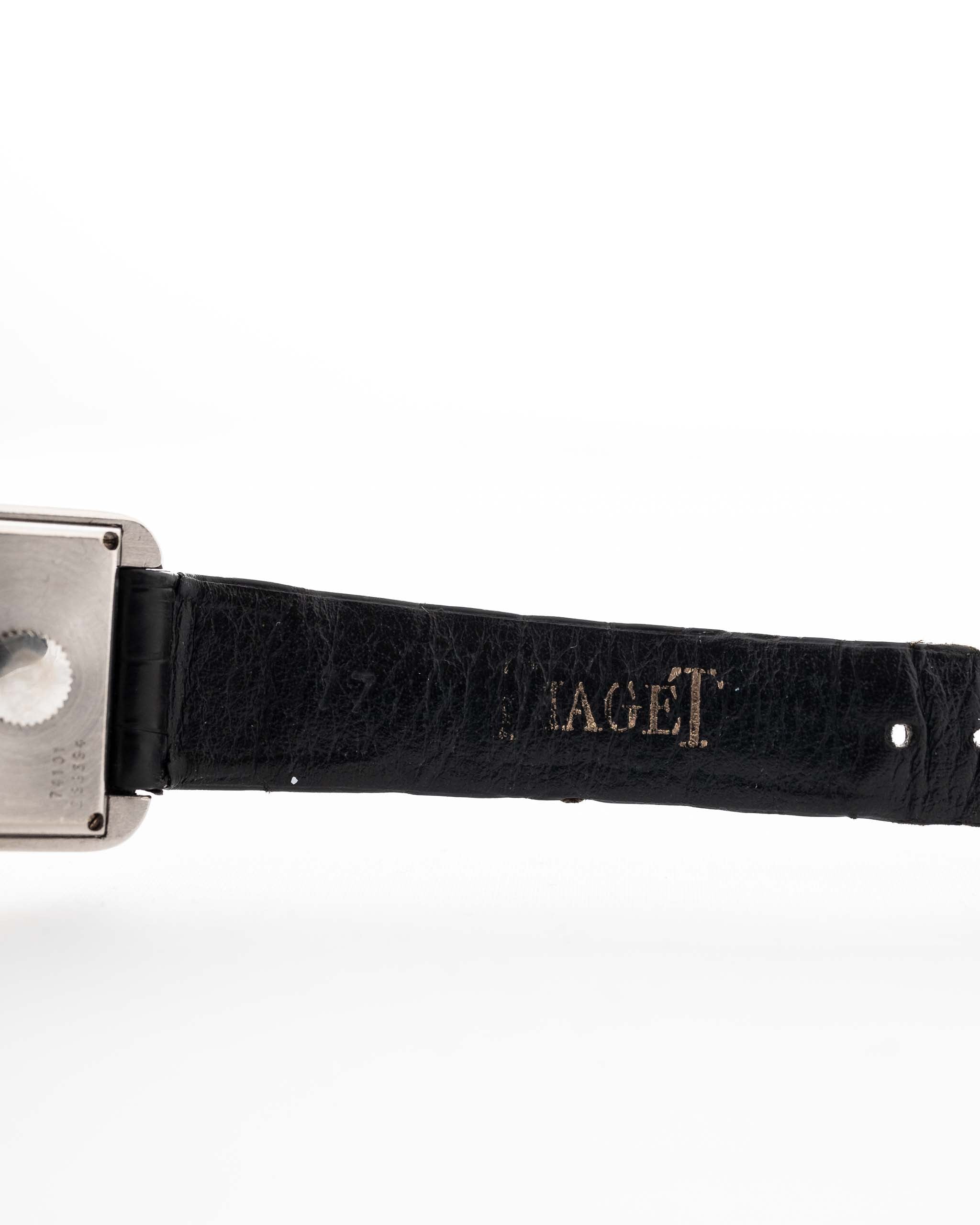 Closeup Photo of a Piaget Protocole 74101 Onyx 18k Diamond from the 1980s on a wrist. 26mm 18k White Gold Case with Onyx Dial with 4 Diamonds, Quartz Movement and Original Leather Strap.