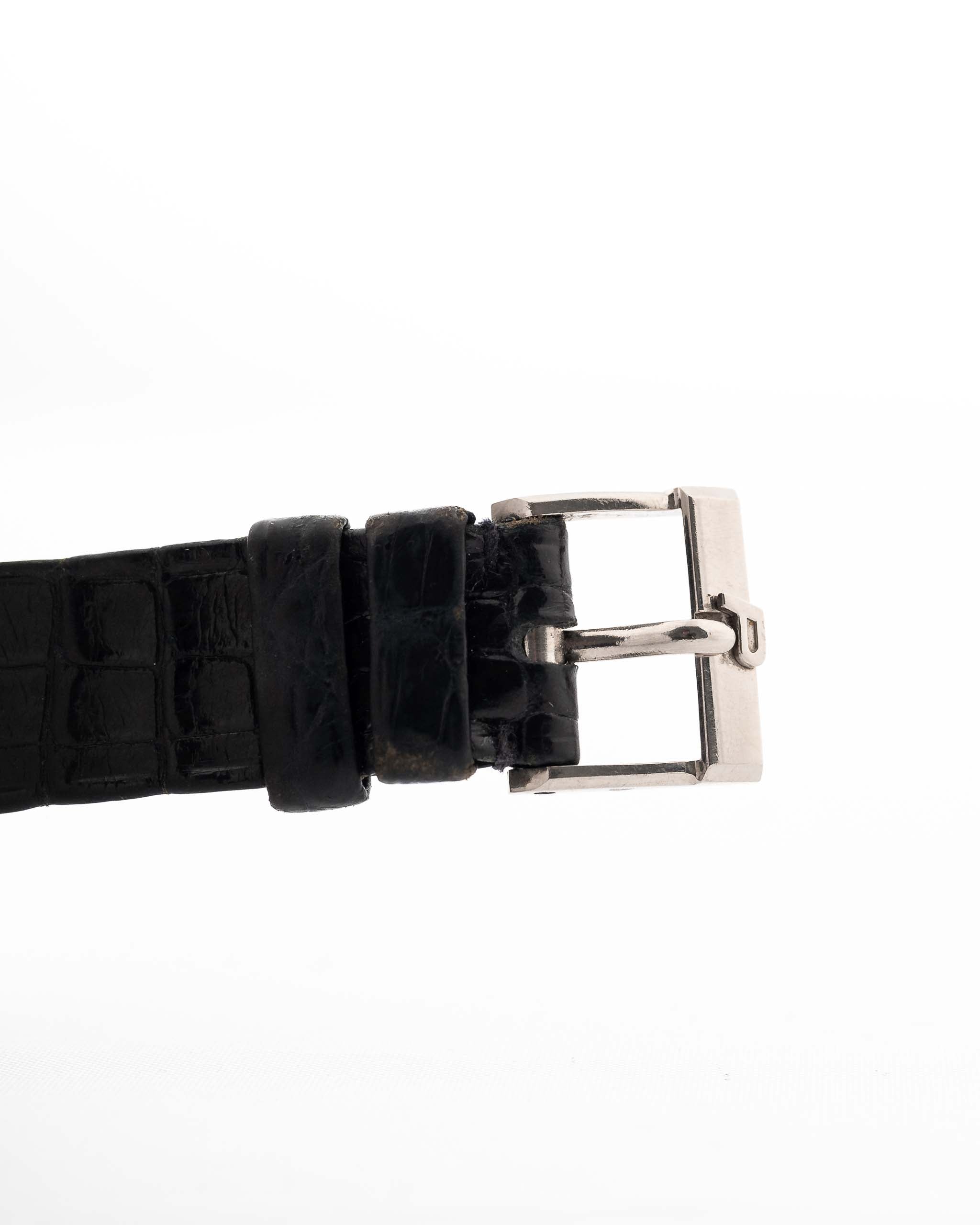 Closeup Photo of a Piaget Protocole 74101 Onyx 18k Diamond from the 1980s on a wrist. 26mm 18k White Gold Case with Onyx Dial with 4 Diamonds, Quartz Movement and Original Leather Strap.