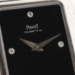 Closeup Photo of a Piaget Protocole 74101 Onyx 18k Diamond from the 1980s on a wrist. 26mm 18k White Gold Case with Onyx Dial with 4 Diamonds, Quartz Movement and Original Leather Strap.