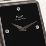 Closeup Photo of a Piaget Protocole 74101 Onyx 18k Diamond from the 1980s on a wrist. 26mm 18k White Gold Case with Onyx Dial with 4 Diamonds, Quartz Movement and Original Leather Strap.