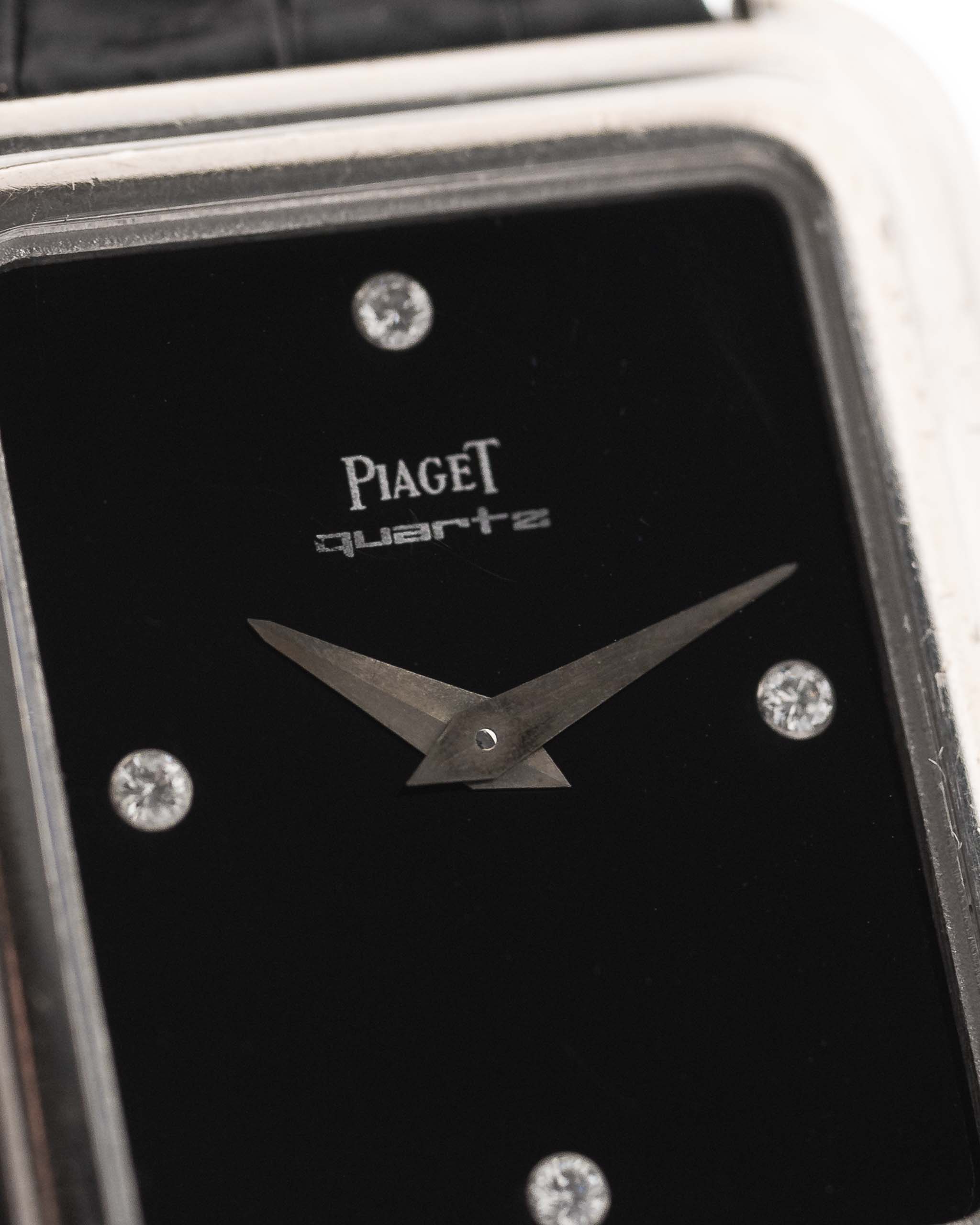 Closeup Photo of a Piaget Protocole 74101 Onyx 18k Diamond from the 1980s on a wrist. 26mm 18k White Gold Case with Onyx Dial with 4 Diamonds, Quartz Movement and Original Leather Strap.