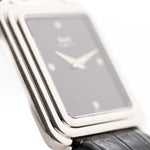 Closeup Photo of a Piaget Protocole 74101 Onyx 18k Diamond from the 1980s on a wrist. 26mm 18k White Gold Case with Onyx Dial with 4 Diamonds, Quartz Movement and Original Leather Strap.
