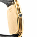 Closeup Sideview Photo of a Piaget Tonneau 9691 Onyx 18k from the 1970s. 24mm with 18k Yellow Gold Case, Manual Wind Movement, Black Onyx Dial and Original black Leather Strap.