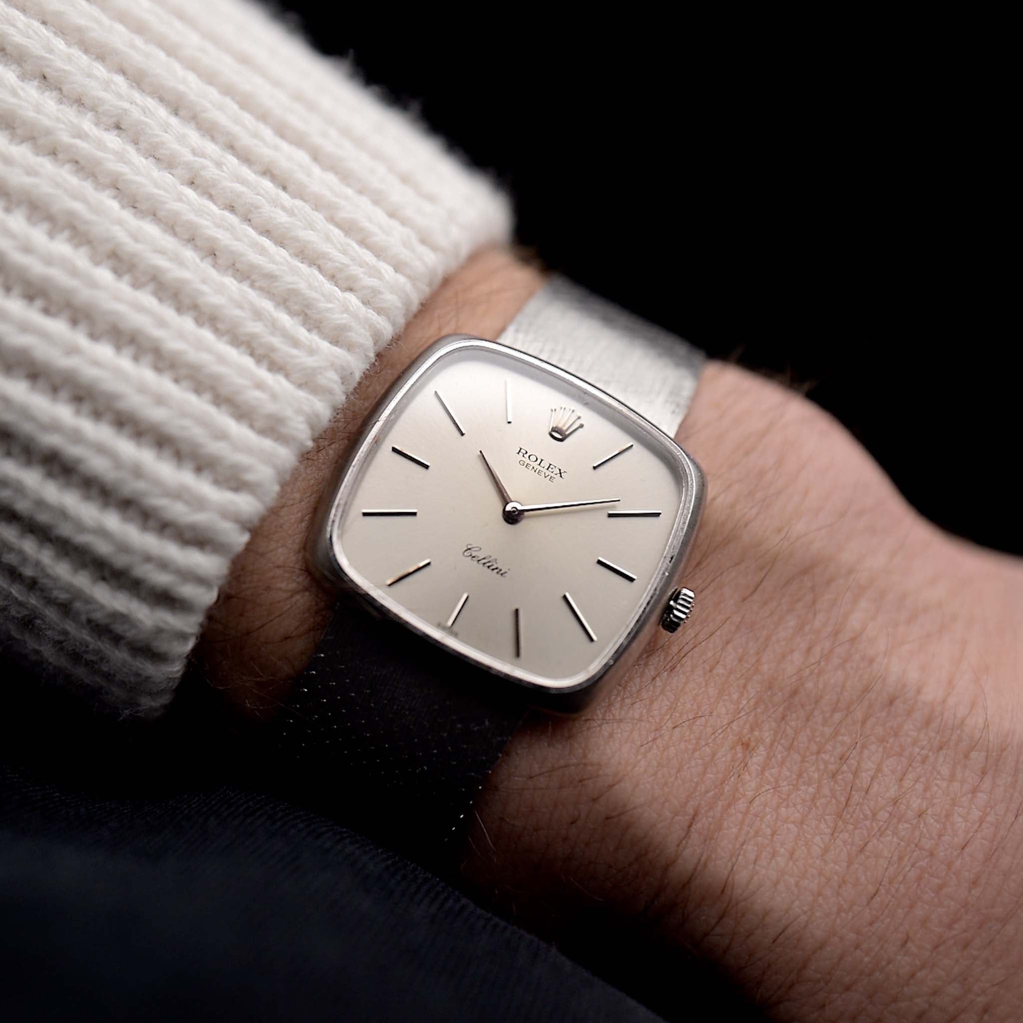 Photo of a Rolex Cellini 3805 Square 18k from 1970 on a wrist. 31.5mm in 18k White Gold with Manual Wind Movement, Original Silver Sunburst Dial and White Gold Bracelet.