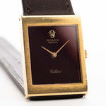 Closeup Photo of a Rolex Cellini 4014 Burgundy from 1972. 18k yellow gold case, 22.5mm with Burgundy dial, Manual movement, Original hands, Leather strap.