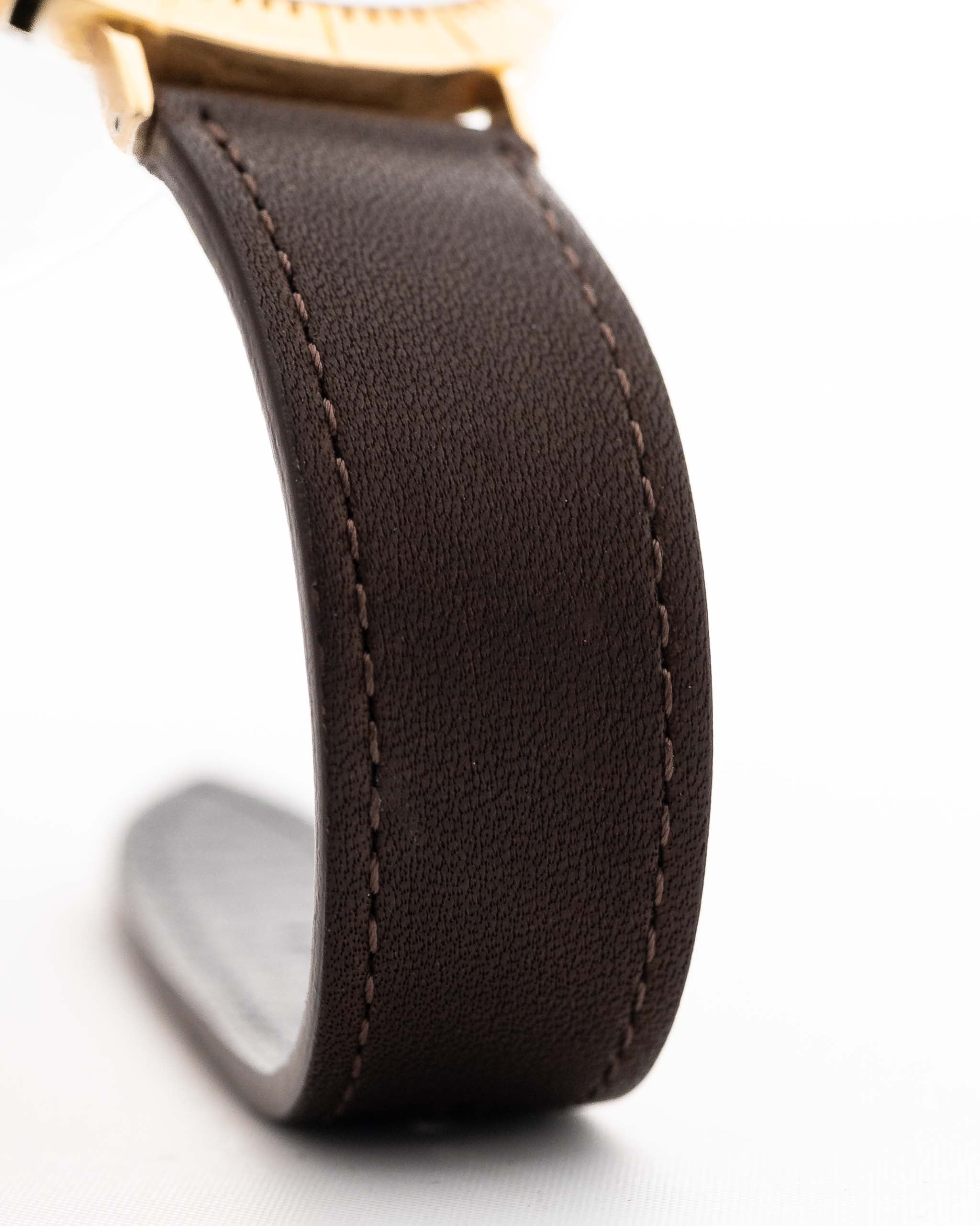 Closeup of a Vintage Rolex Cellini 4083 Ombre from 1973. 33mm with 18k Yellow Gold Case, Manual Wind Movement, Original Brown Ombre Dial and Leather Strap.