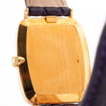 Closeup Photo of a Rolex Cellini 4087 Rectangular from 1995. 27.5mm in 18k Yellow Gold with Manual Wind Movement, Silver Sunburst Dial and Original Leather Strap.