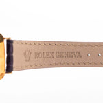 Closeup Photo of a Rolex Cellini 4087 Rectangular from 1995. 27.5mm in 18k Yellow Gold with Manual Wind Movement, Silver Sunburst Dial and Original Leather Strap.