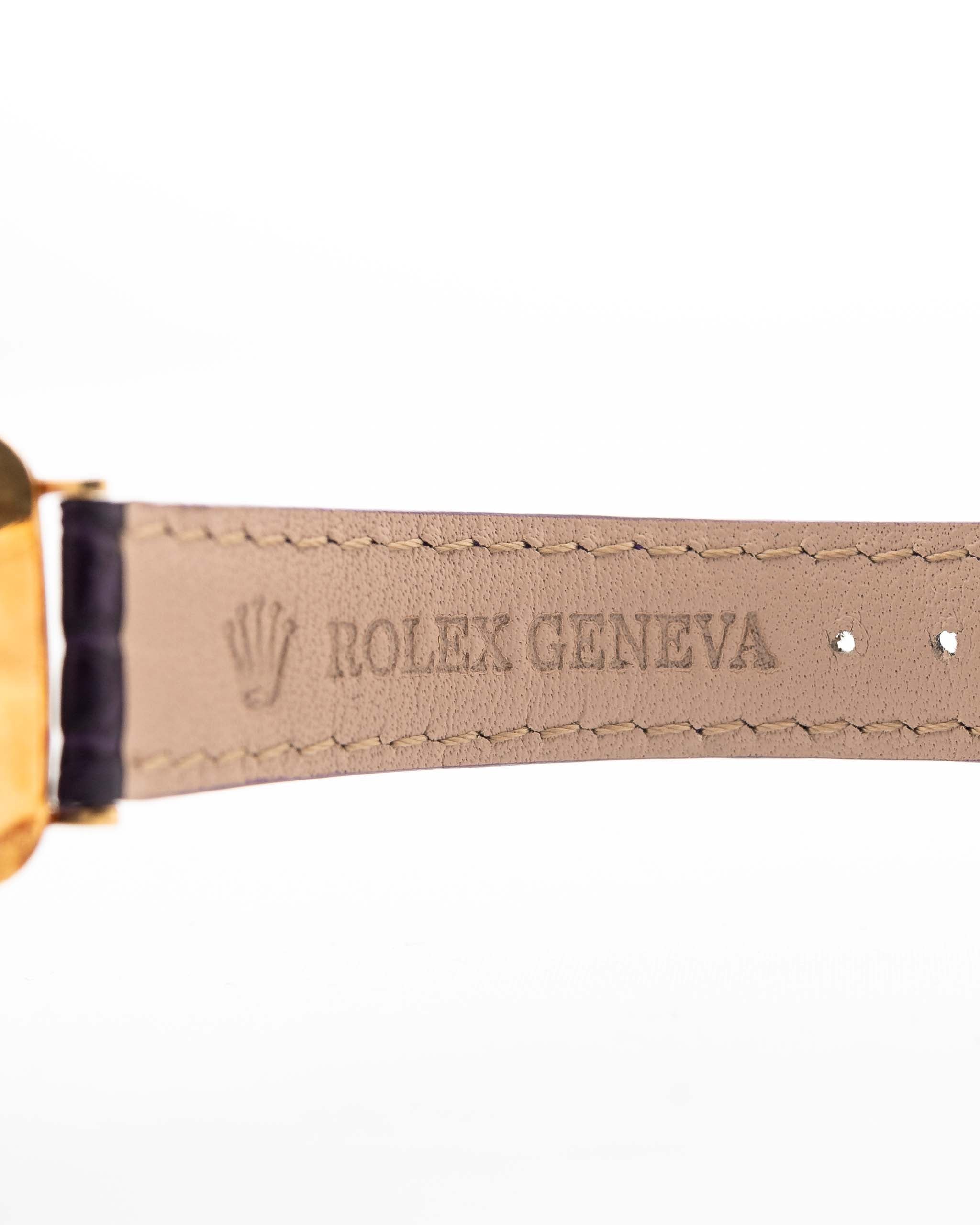 Closeup Photo of a Rolex Cellini 4087 Rectangular from 1995. 27.5mm in 18k Yellow Gold with Manual Wind Movement, Silver Sunburst Dial and Original Leather Strap.