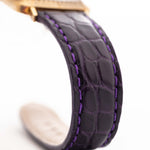 Closeup Photo of a Rolex Cellini 4087 Rectangular from 1995. 27.5mm in 18k Yellow Gold with Manual Wind Movement, Silver Sunburst Dial and Original Purple Leather Strap.