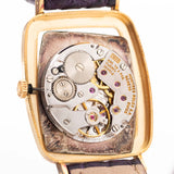 Closeup Photo of a Rolex Cellini 4087 Rectangular Movement from 1995. 27.5mm in 18k Yellow Gold with Manual Wind Movement, Silver Sunburst Dial and Original Leather Strap.