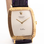 Closeup Photo of a Rolex Cellini 4087 Rectangular from 1995. 27.5mm in 18k Yellow Gold with Manual Wind Movement, Silver Sunburst Dial and Original Leather Strap.