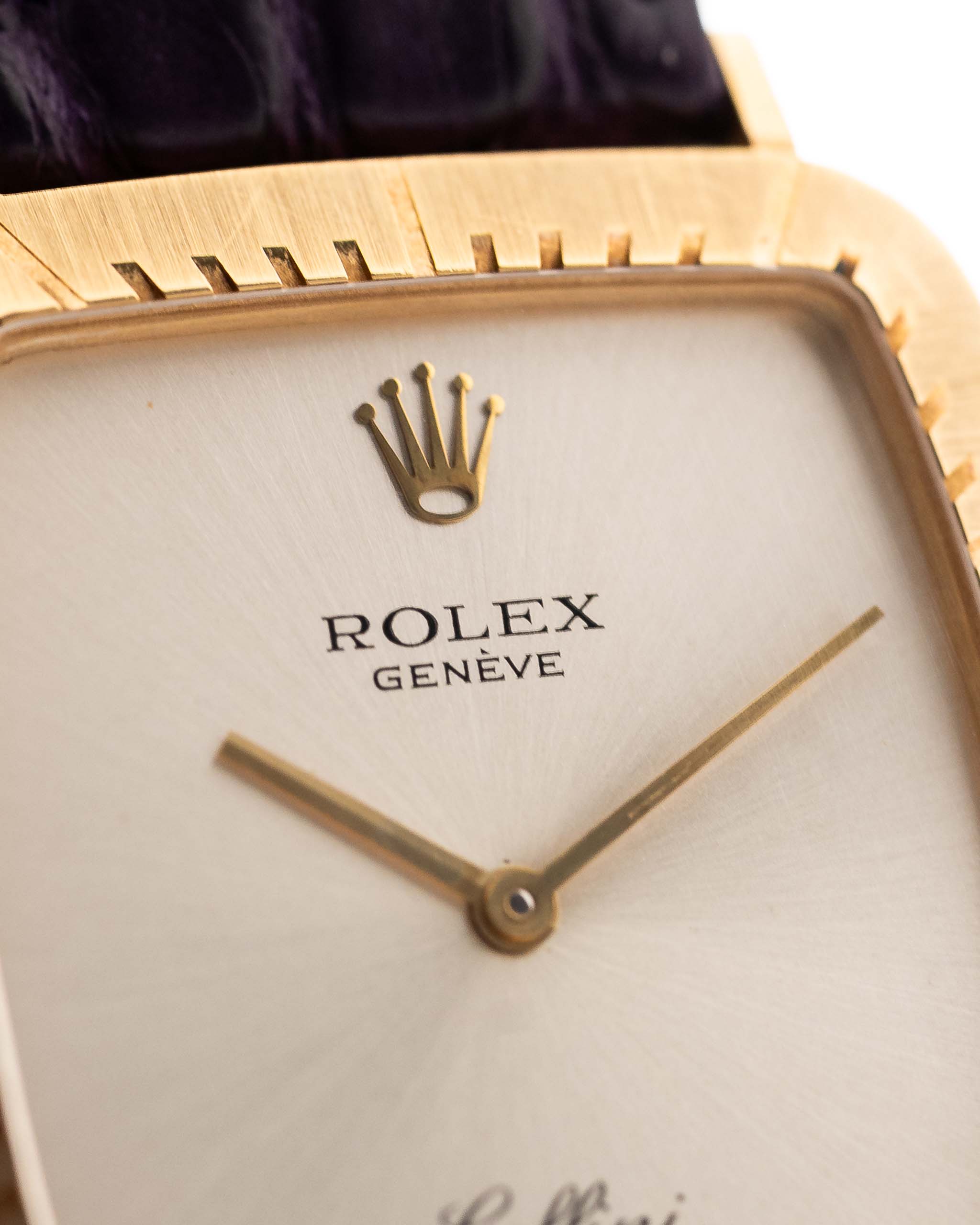 Closeup Photo of a Rolex Cellini 4087 Rectangular from 1995. 27.5mm in 18k Yellow Gold with Manual Wind Movement, Silver Sunburst Dial and Original Leather Strap.