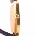 Closeup Photo of a Rolex Cellini 4087 Rectangular from 1995. 27.5mm in 18k Yellow Gold with Manual Wind Movement, Silver Sunburst Dial and Original Leather Strap.