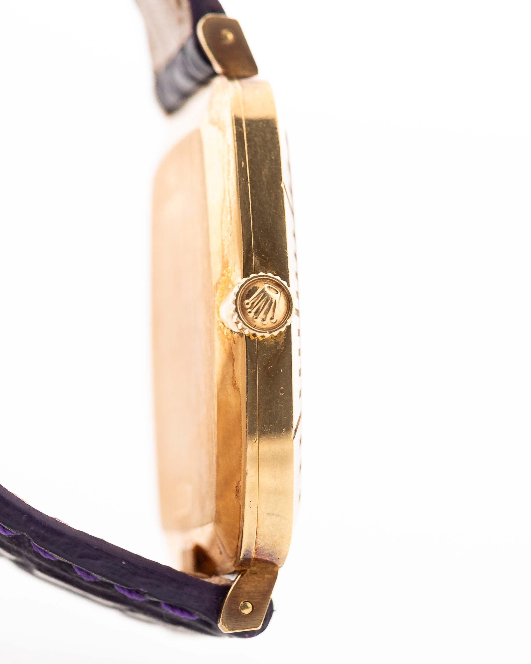 Closeup Photo of a Rolex Cellini 4087 Rectangular from 1995. 27.5mm in 18k Yellow Gold with Manual Wind Movement, Silver Sunburst Dial and Original Leather Strap.