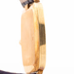 Closeup Photo of a Rolex Cellini 4087 Rectangular from 1995. 27.5mm in 18k Yellow Gold with Manual Wind Movement, Silver Sunburst Dial and Original Leather Strap.
