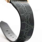 Closeup Photo of a Rolex Cellini 4105 Rectangular Black from 1976. 25.5mm  18k yellow gold case with Manual wind movement, Original black tapestry dial and Leather strap.
