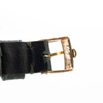 Closeup Photo of a Rolex Cellini 4105 Rectangular Black from 1976. 25.5mm  18k yellow gold case with Manual wind movement, Original black tapestry dial and Leather strap.