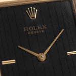 Closeup Photo of a Rolex Cellini 4105 Rectangular Black from 1976. 25.5mm  18k yellow gold case with Manual wind movement, Original black tapestry dial and Leather strap.