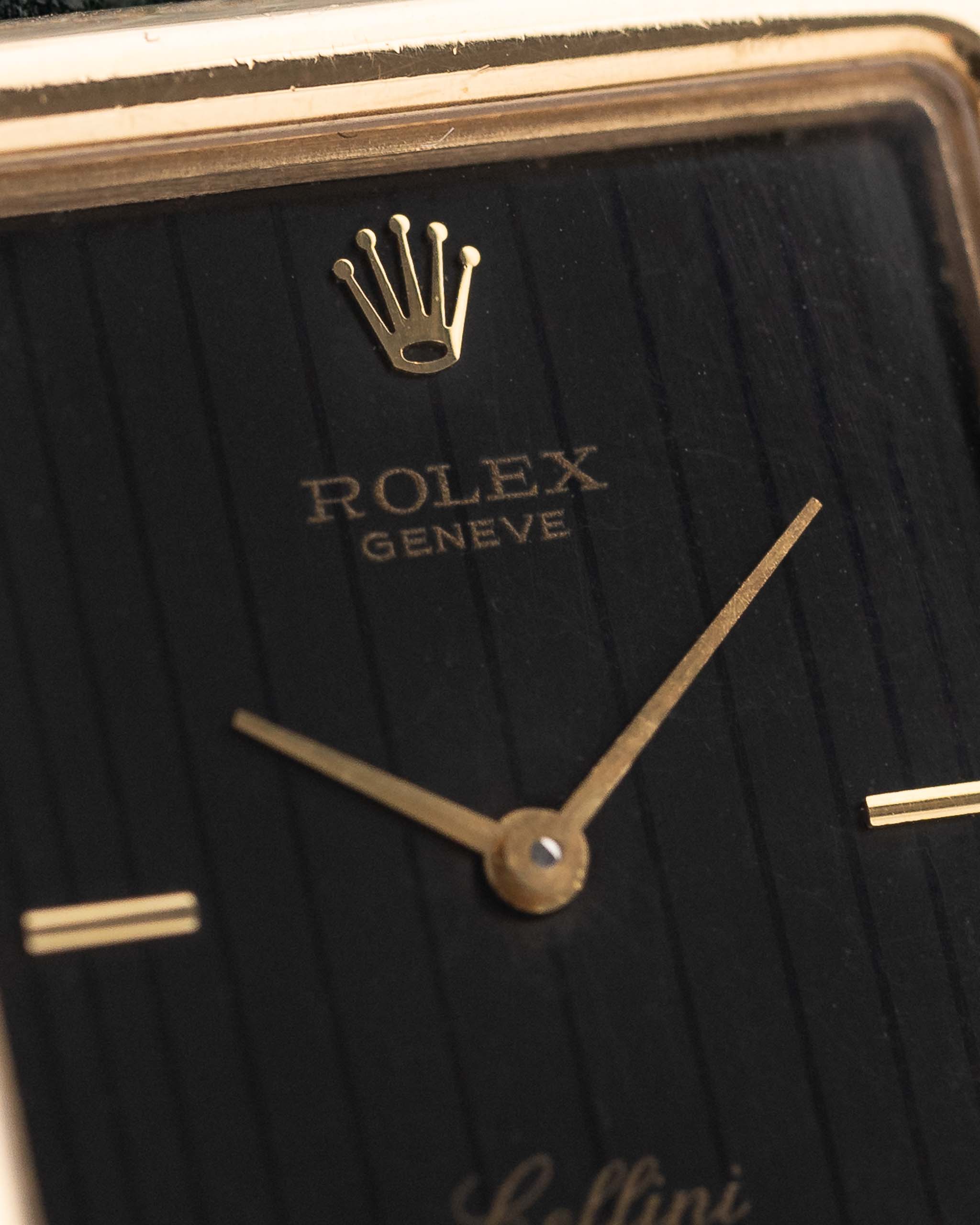 Closeup Photo of a Rolex Cellini 4105 Rectangular Black from 1976. 25.5mm  18k yellow gold case with Manual wind movement, Original black tapestry dial and Leather strap.