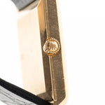 Closeup Photo of a Rolex Cellini 4105 Rectangular Black from 1976. 25.5mm  18k yellow gold case with Manual wind movement, Original black tapestry dial and Leather strap.