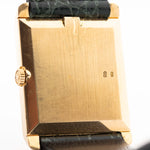 Closeup Photo of a Rolex Cellini 4105 Rectangular Black from 1976. 25.5mm  18k yellow gold case with Manual wind movement, Original black tapestry dial and Leather strap.