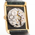 Closeup Photo of a Rolex Cellini 4105 Rectangular Black from 1976. 25.5mm  18k yellow gold case with Manual wind movement, Original black tapestry dial and Leather strap.