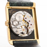 Closeup Photo of a Rolex Cellini 4105 Rectangular Black from 1976. 25.5mm  18k yellow gold case with Manual wind movement, Original black tapestry dial and Leather strap.