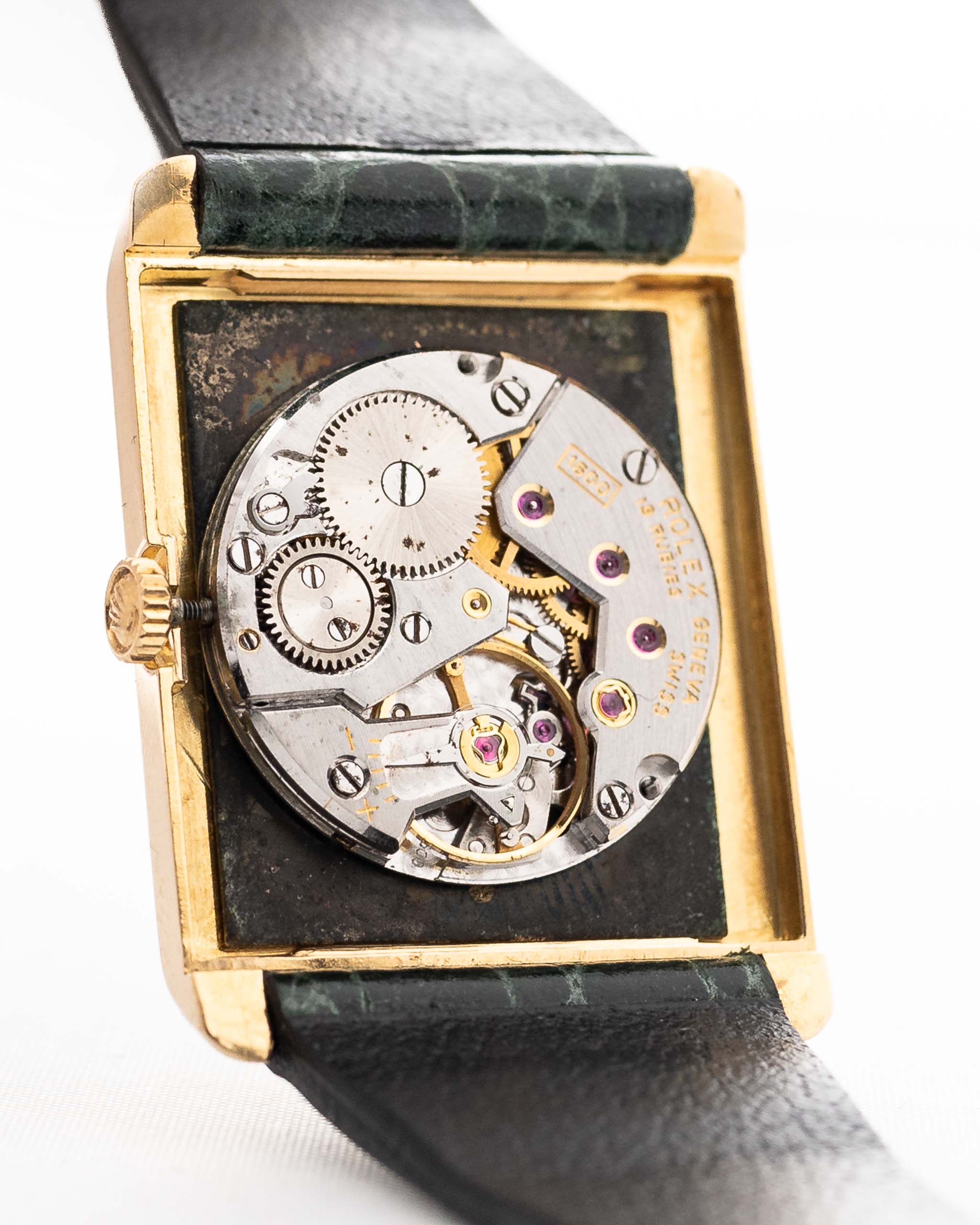 Closeup Photo of a Rolex Cellini 4105 Rectangular Black from 1976. 25.5mm  18k yellow gold case with Manual wind movement, Original black tapestry dial and Leather strap.