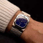 Vintage Rolex Cellini 4350 Octagon Blue Watch from 1983 on a wrist. 27mm with 18k White Gold Case, Royal Blue Dial, 18k White Gold President Bracelet and Manual-wound Caliber 1601.