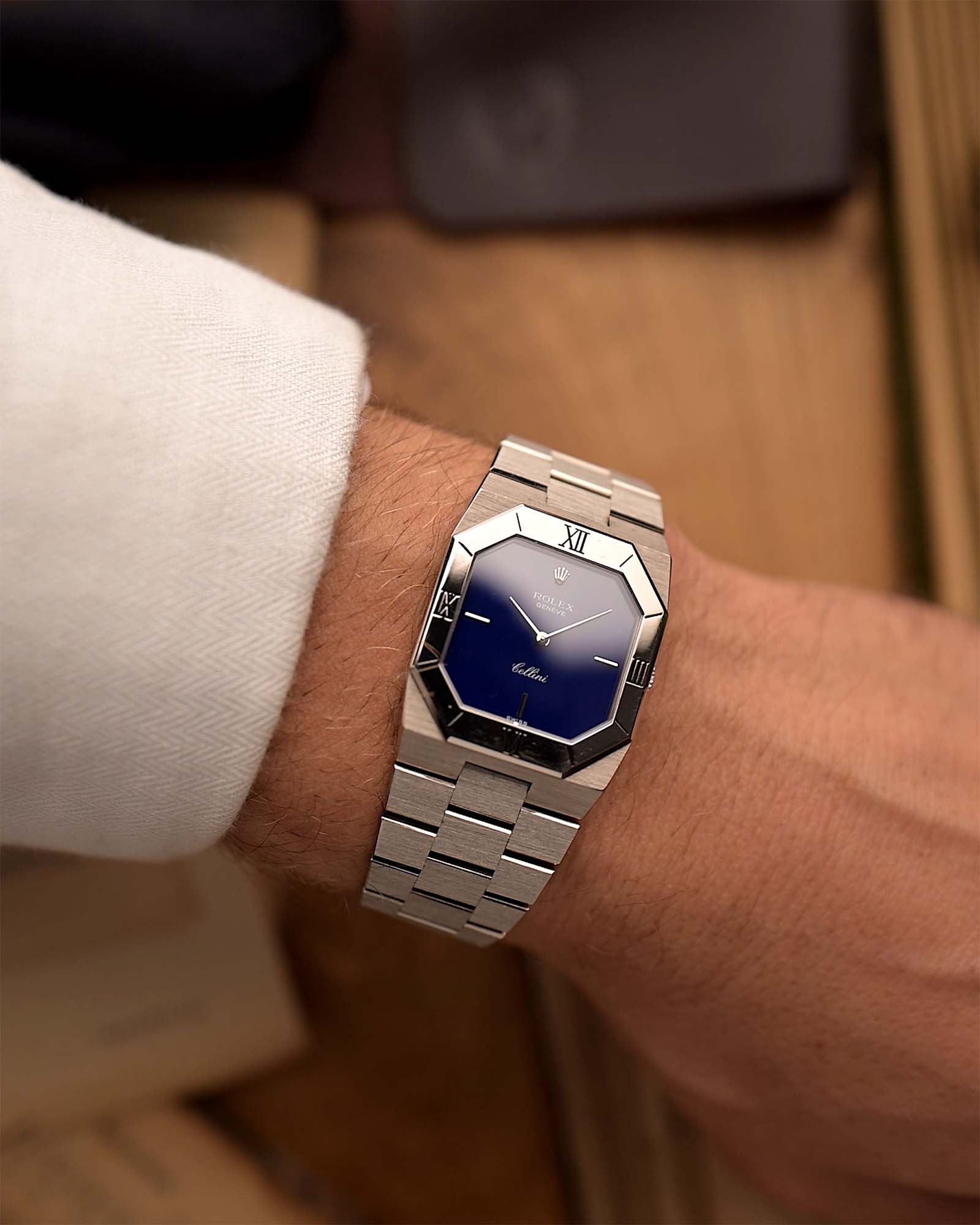 Vintage Rolex Cellini 4350 Octagon Blue Watch from 1983 on a wrist. 18k White Gold Case, Royal Blue Dial, 18k White Gold President Bracelet and Manual-wound Caliber 1601.