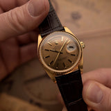 Rolex Day-Date 18038 Havana dial with day-date display and fluted bezel close-up, 18k gold