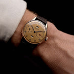 Photo of Universal Genève 18k Rose Triple Calendar 1940s on wrist - reference- 11301 - GOLDAMMER