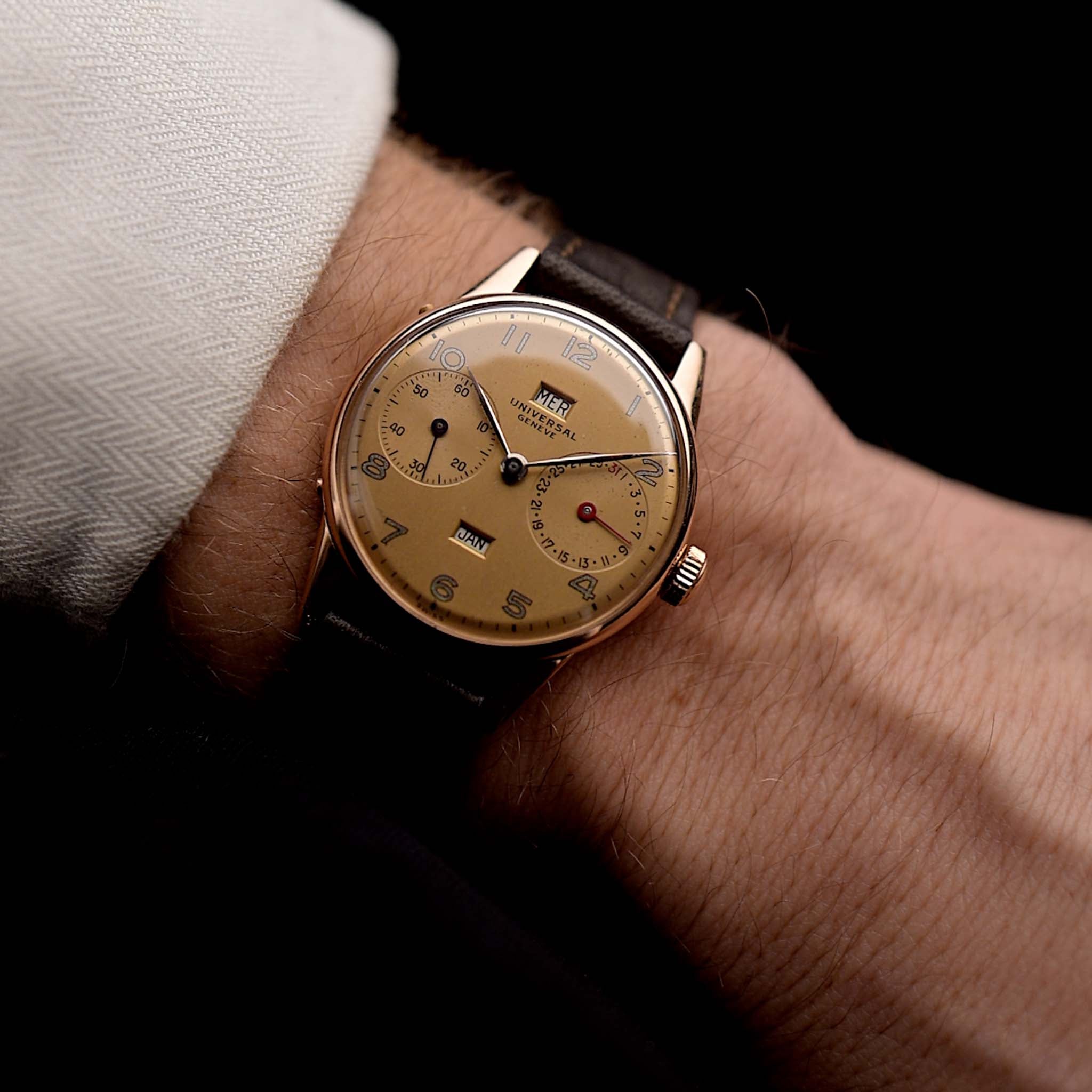 Photo of Universal Genève 18k Rose Triple Calendar 1940s on wrist - reference- 11301 - GOLDAMMER