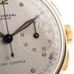 Vintage Universal Geneve 5166 Uni Compax 18k gold 1950 silver vertical brushed dial closeup
