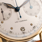 Vintage Universal Geneve 5166 Uni Compax 18k gold 1950 silver vertical brushed dial closeup