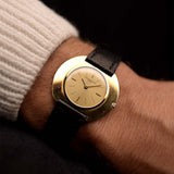 Vintage Vacheron Constantin Disco Volante 6590 watch from 1960s on a wrist. 34mm in 18k Yellow Gold with Flawless Gold sunburst dial, Manual wind movement and Leather Strap.