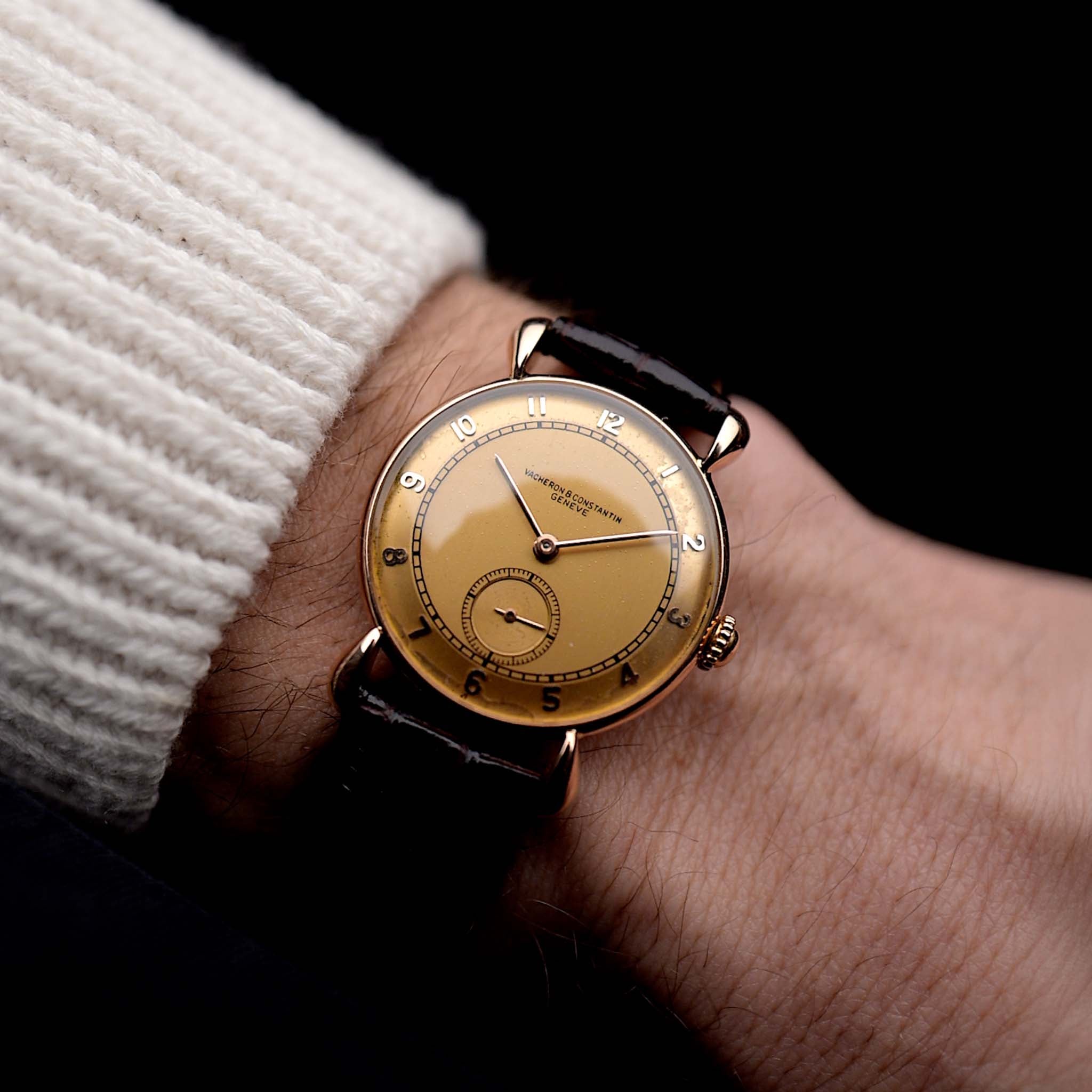 Photo of a Vintage Vacheron Constantin 18k Rosé Teardrop from the 1940s on a wrist. 30mm 18k Rose Gold Case with Manual Wind Movement, Original Gold Dial and Leather Strap.