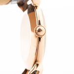 Closeup Photo of a Vacheron Constantin 18k Rosé Teardrop from the 1940s. 30mm 18k Rose Gold Case with Manual Wind Movement, Original Gold Dial and Leather Strap.