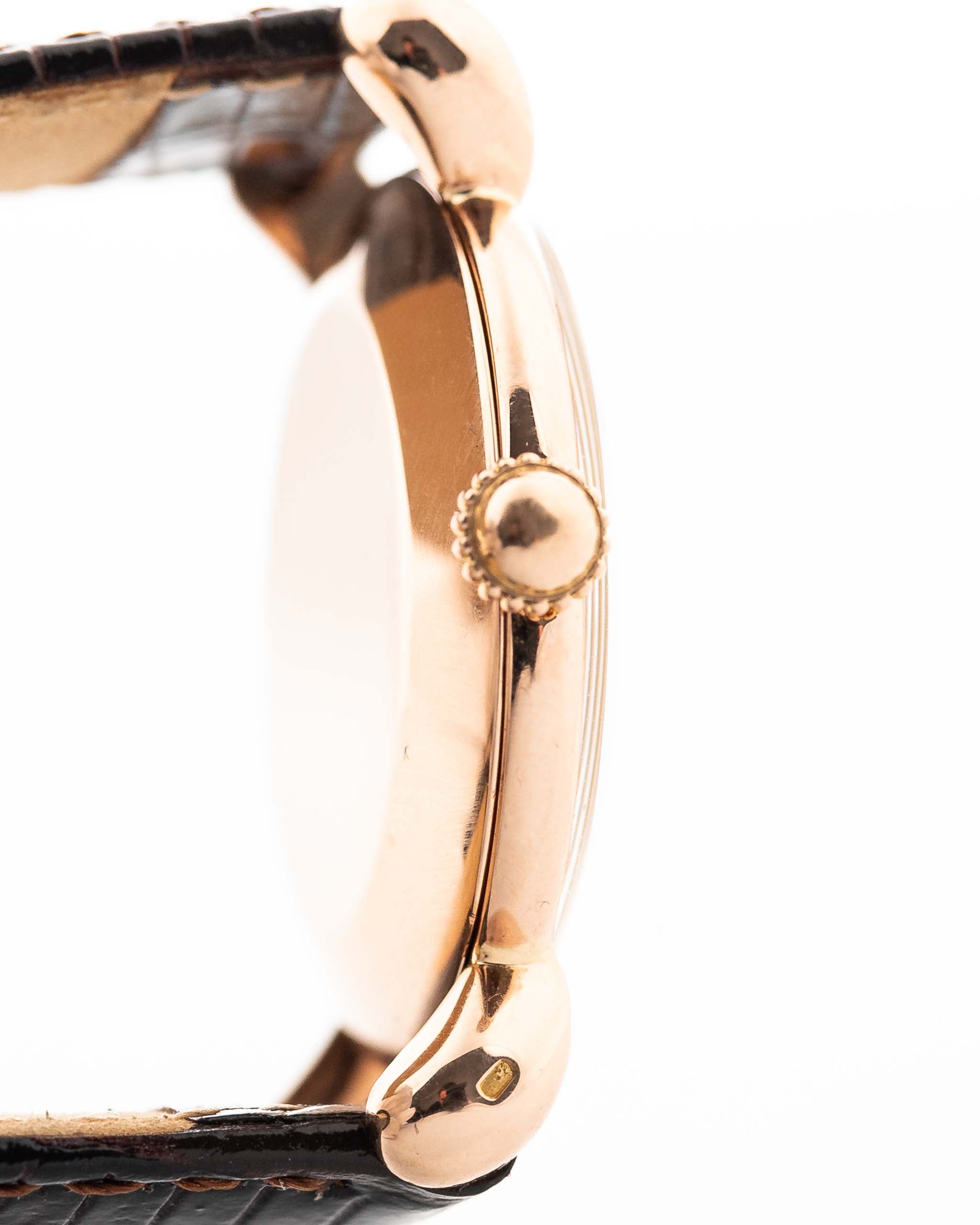 Closeup Photo of a Vacheron Constantin 18k Rosé Teardrop from the 1940s. 30mm 18k Rose Gold Case with Manual Wind Movement, Original Gold Dial and Leather Strap.