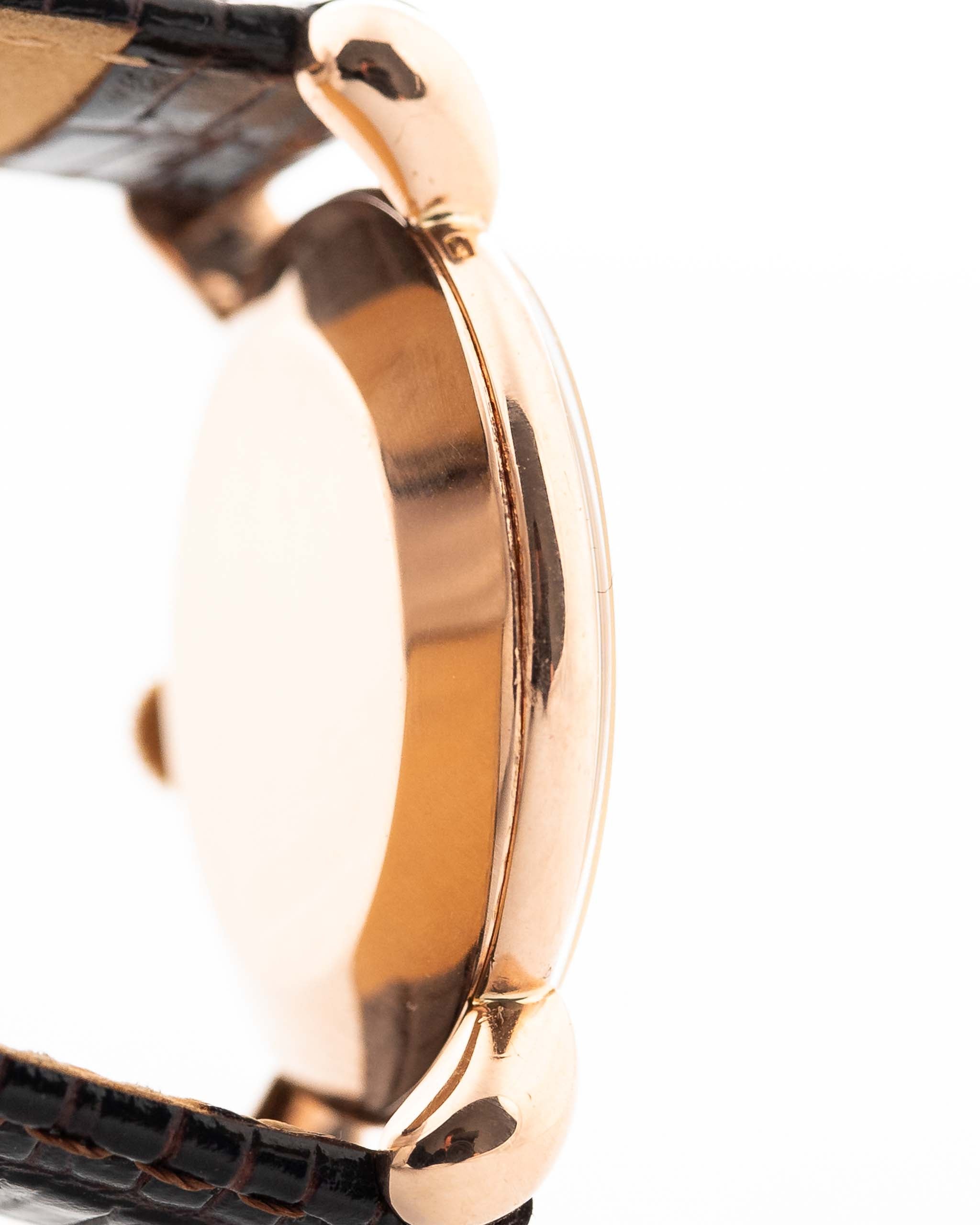 Closeup Photo of a Vacheron Constantin 18k Rosé Teardrop from the 1940s. 30mm 18k Rose Gold Case with Manual Wind Movement, Original Gold Dial and Leather Strap.