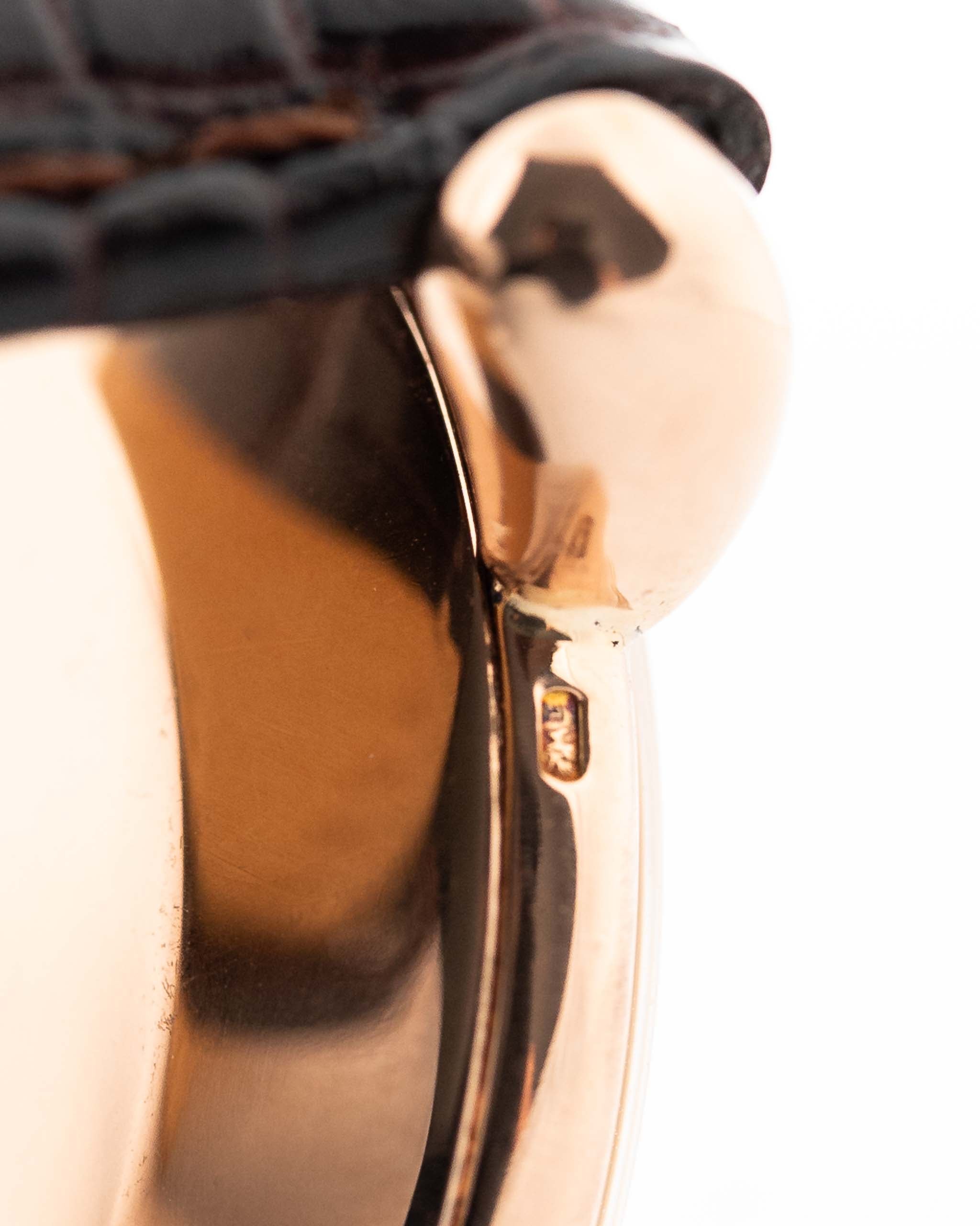 Closeup Photo of a Vacheron Constantin 18k Rosé Teardrop from the 1940s. 30mm 18k Rose Gold Case with Manual Wind Movement, Original Gold Dial and Leather Strap.
