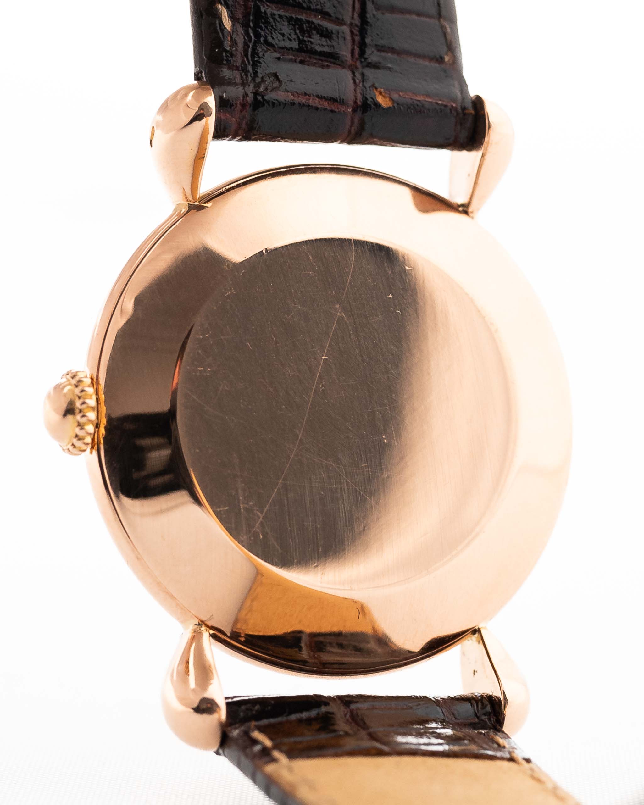 Closeup Photo of a Vacheron Constantin 18k Rosé Teardrop from the 1940s. 30mm 18k Rose Gold Case with Manual Wind Movement, Original Gold Dial and Leather Strap.