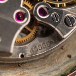 Closeup Photo of a Vacheron Constantin 18k Rosé Teardrop from the 1940s. 30mm 18k Rose Gold Case with Manual Wind Movement, Original Gold Dial and Leather Strap.