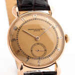 Closeup Photo of a Vintage Vacheron Constantin 18k Rosé Teardrop from the 1940s. 30mm 18k Rose Gold Case with Manual Wind Movement, Original Gold Dial and Leather Strap.