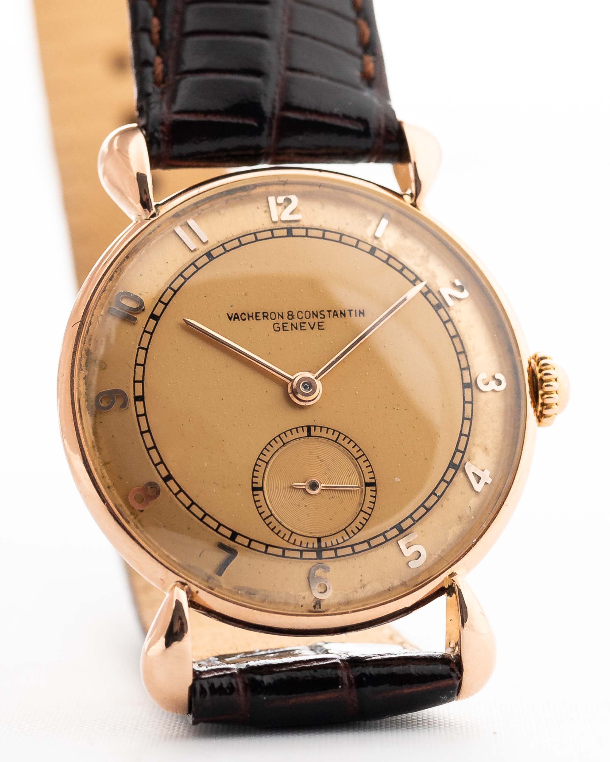 Closeup Photo of a Vintage Vacheron Constantin 18k Rosé Teardrop from the 1940s. 30mm 18k Rose Gold Case with Manual Wind Movement, Original Gold Dial and Leather Strap.
